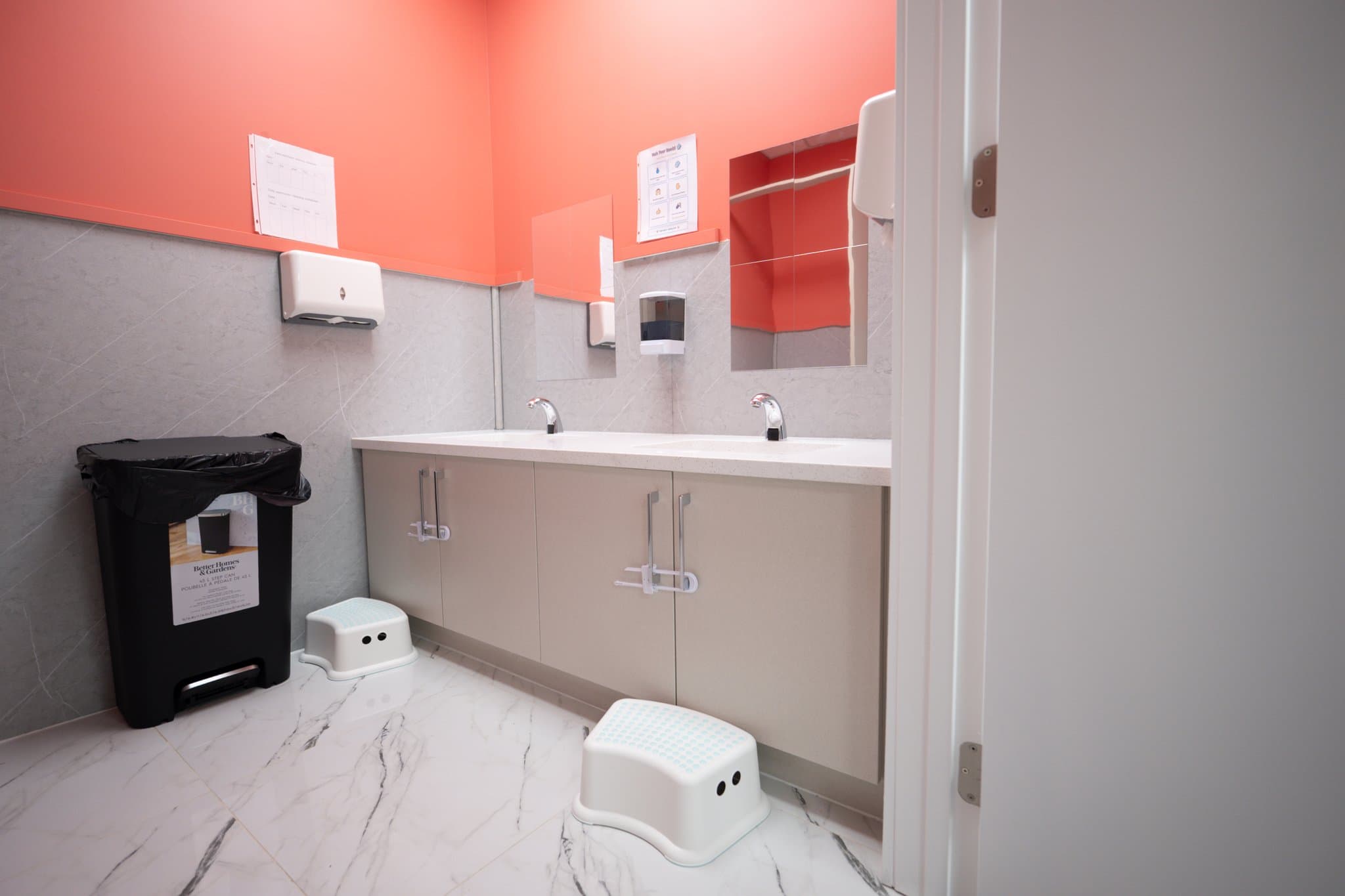 Clean child-height sinks and washroom facilities promoting hygiene and self-reliance